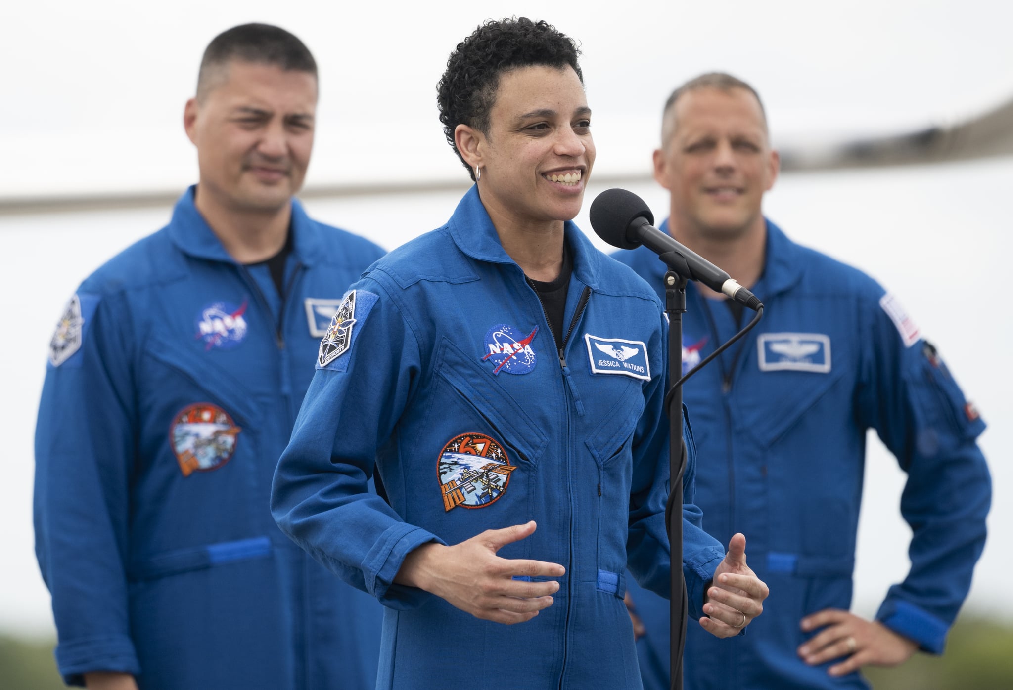 CAPE CANAVERAL, FL - APRIL 18: In this NASA handout, NASA astronaut Jessica Watkins speaks to members of the media after arriving at the Launch and Landing Facility at NASAs Kennedy Space Centre with fellow crewmates NASA astronauts Robert Hines, Kjell Lindgren, and ESA (European Space Agency) astronaut Samantha Cristoforetti ahead of SpaceXs Crew-4 mission, Monday, April 18, 2022, in Florida. NASAs SpaceX Crew-4 mission is the fourth crew rotation mission of the SpaceX Crew Dragon spacecraft and Falcon 9 rocket to the International Space Station as part of the agencys Commercial Crew Program. Lindgren, Hines, Watkins, and Cristoforetti are scheduled to launch at April 23 at 5:26 a.m. EDT, from Launch Complex 39A at the Kennedy Space Centre. (Photo by Joel Kowsky/NASA via Getty Images)