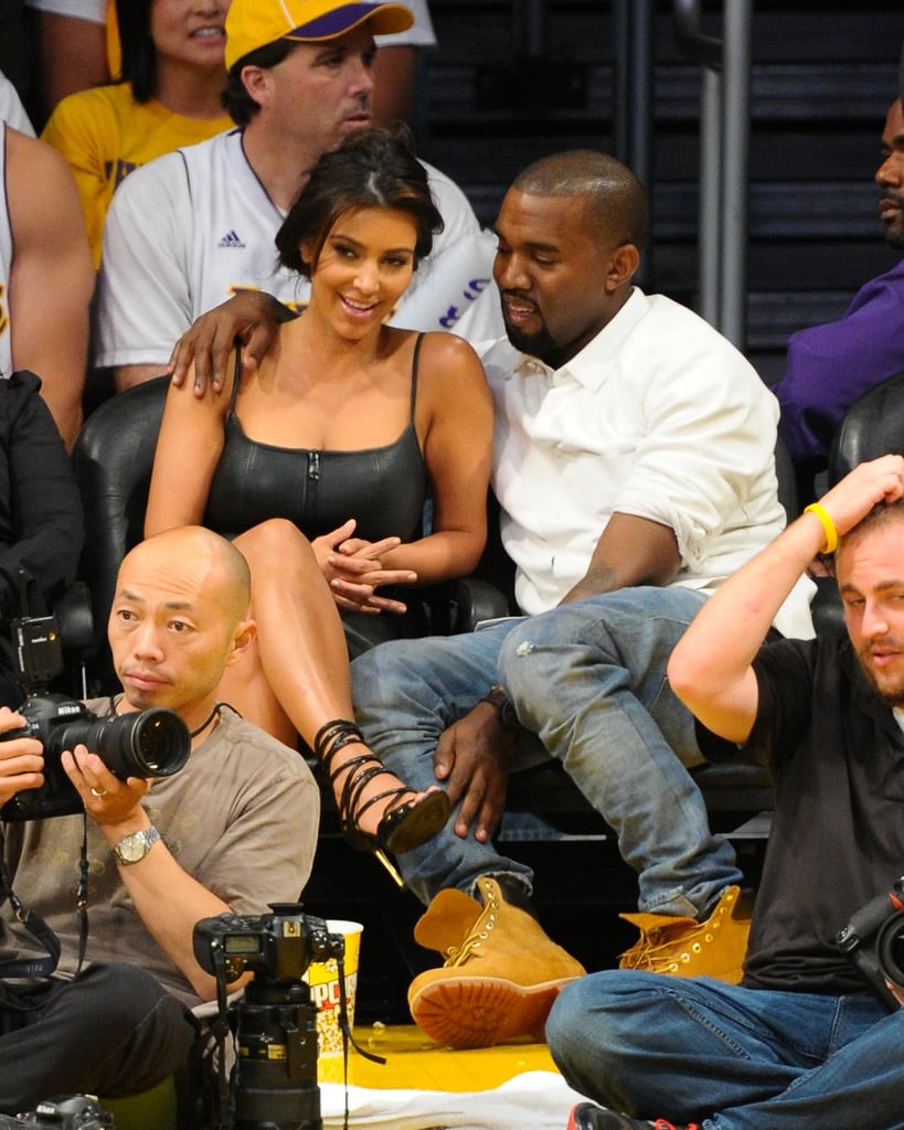 The couple got cosy while taking in an LA Lakers playoff game at the Staples Centre in May 2012.