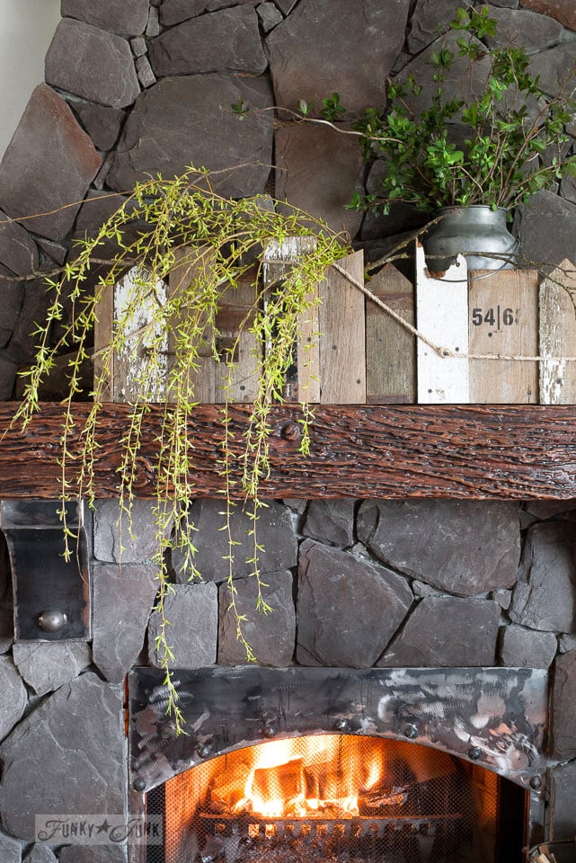 Create a DIY window box for your mantel out of reclaimed scrap wood and fill it with trailing greens.