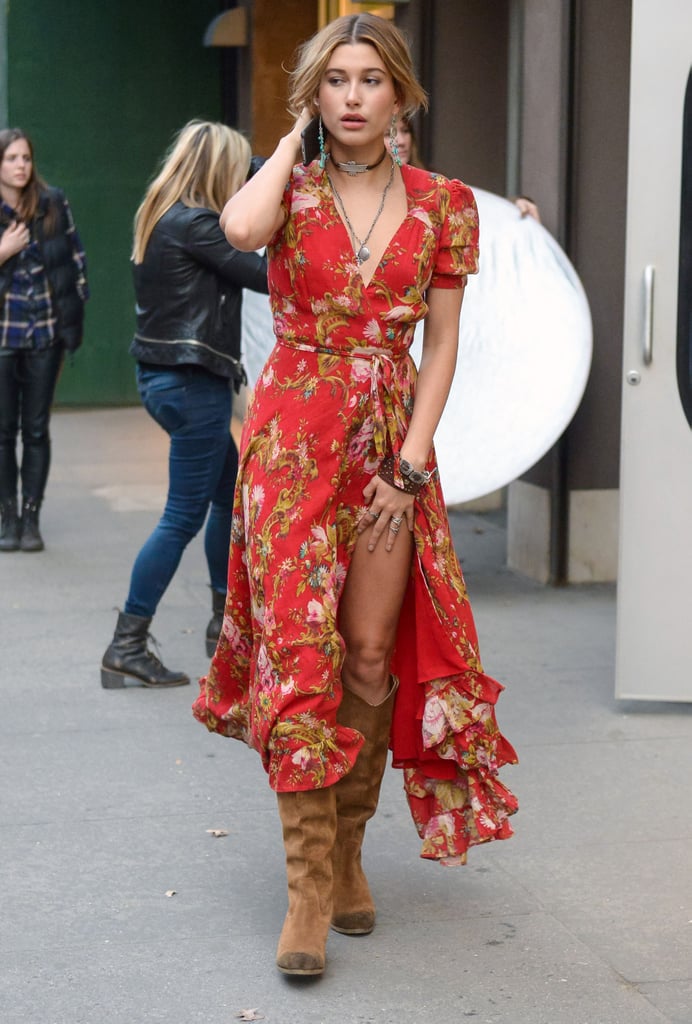 Hailey shrugged off her khaki-colored biker coat to reveal her bohemian dress and even more silver rings and bracelets, including one studded leather band that complemented her choker necklace.