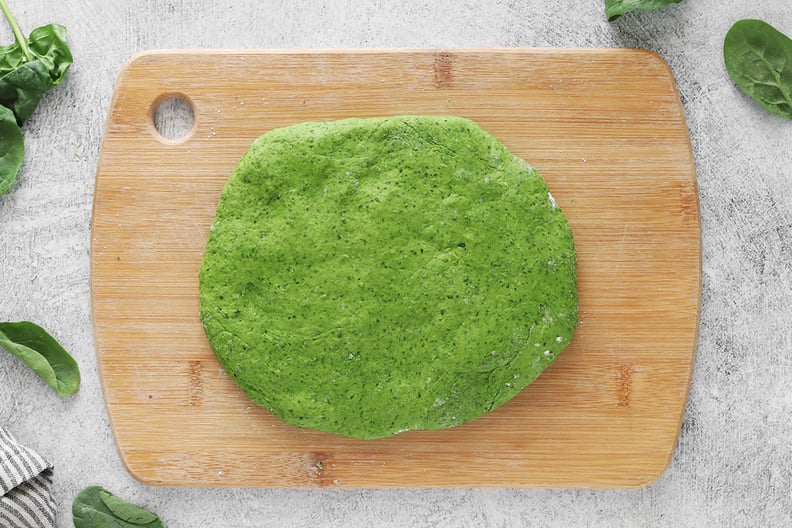 Spinach pasta dough on a cutting board