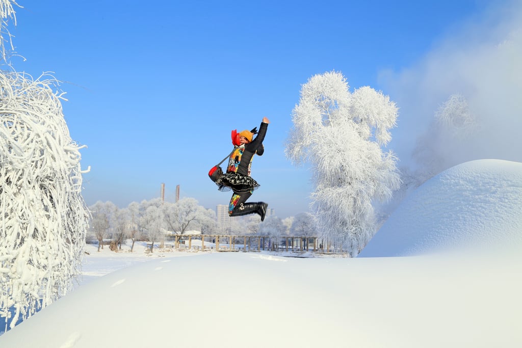 A woman in China jumped up to pose for a snowy snap.
