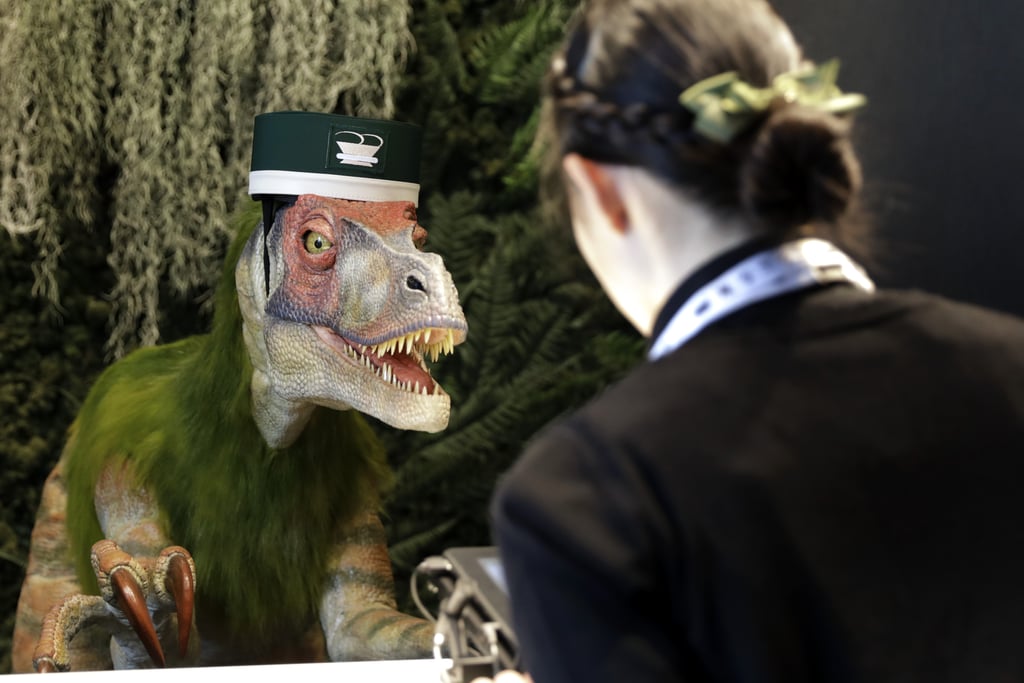 The dinosaur receptionists speak many languages, so they can help out visitors from all over the world. Is this seriously real life?