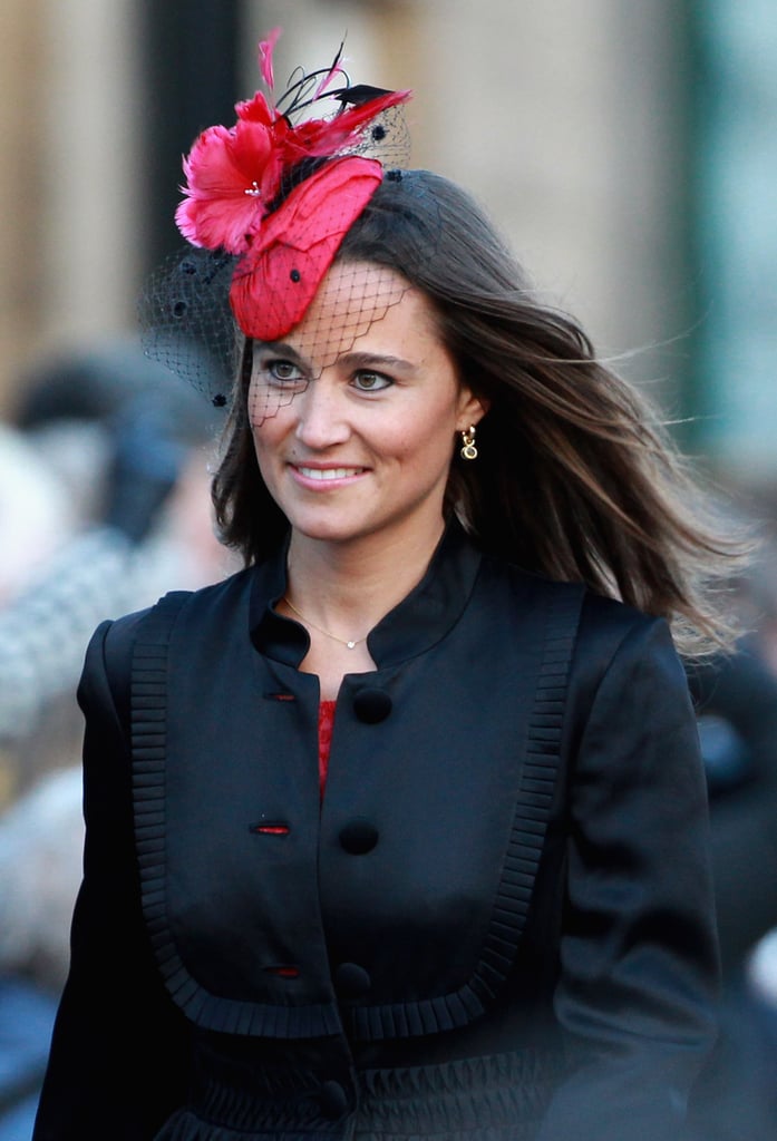 Pippa Middleton wore a pretty red and black — complete with netted veil — fascinator to a wedding in February 2011.