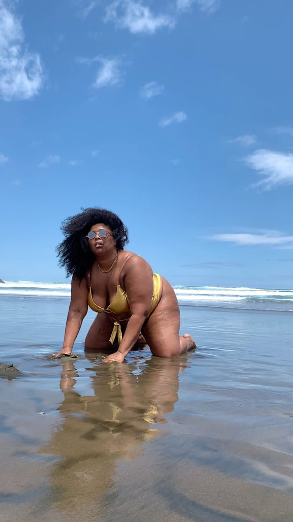 Lizzo Wore a Gold Metallic Cutout Swimsuit in New Zealand