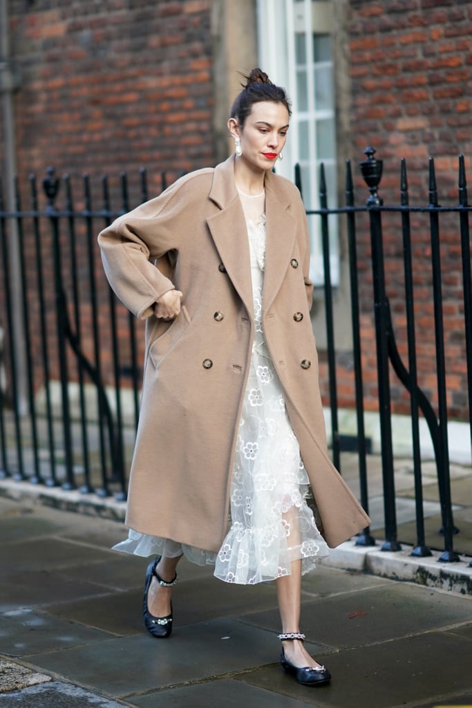 Channel your inner ballerina by styling your flats with an equally girly midi dress and longline coat this season.