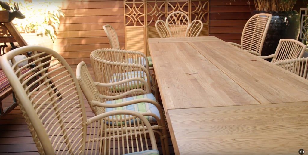The wooden deck has plenty of seating for outdoor meals and card games.