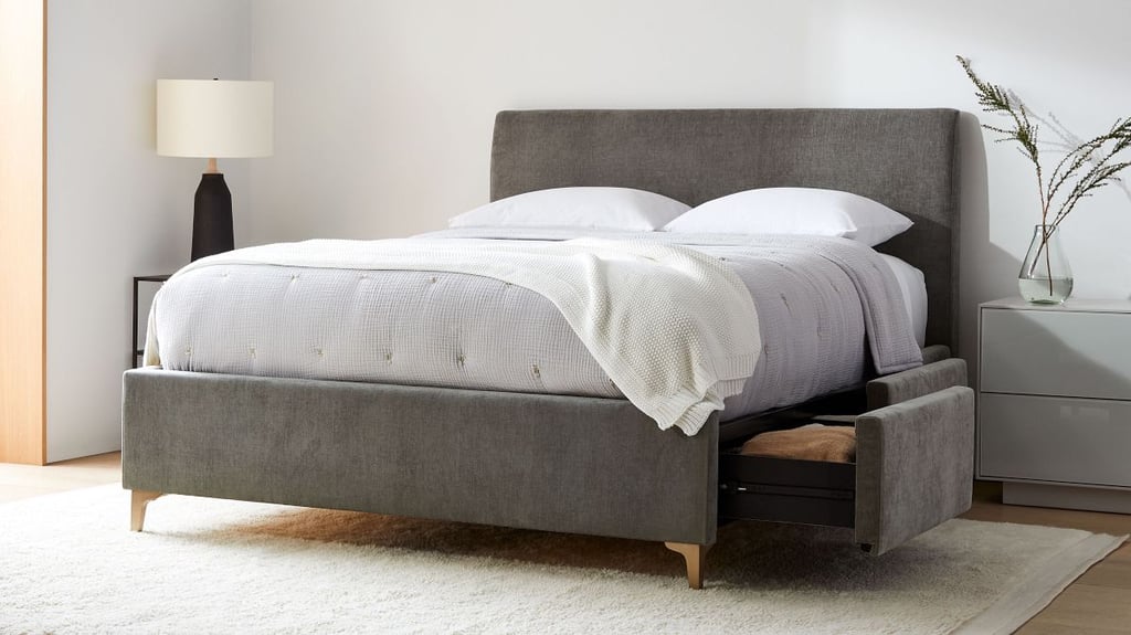 West Elm Andes Side Storage Bed ($1,839-$3,199, originally $1,849, originally $3,199)
The Andes Side Storage Bed offers you tons of extra storage space. This upholstered bed frame has a clean-lined silhouette that provides a luxe look. 
What we love:
Its discrete four drawers are the perfect place to store seasonal apparel, extra bedding and linens, gadgets, spicy games, and more.
Who it's best for:
it's fully customizable; you can choose the type of tufting on the headboard as well as the height, leg style, fabric, and color.
Who should avoid it:
If you have a traditional space, this silhouette and design might not be an ideal fit.
The Details: Material: Various | Sizes: Twin, full, queen, king, and California king | Color Options: 40+
