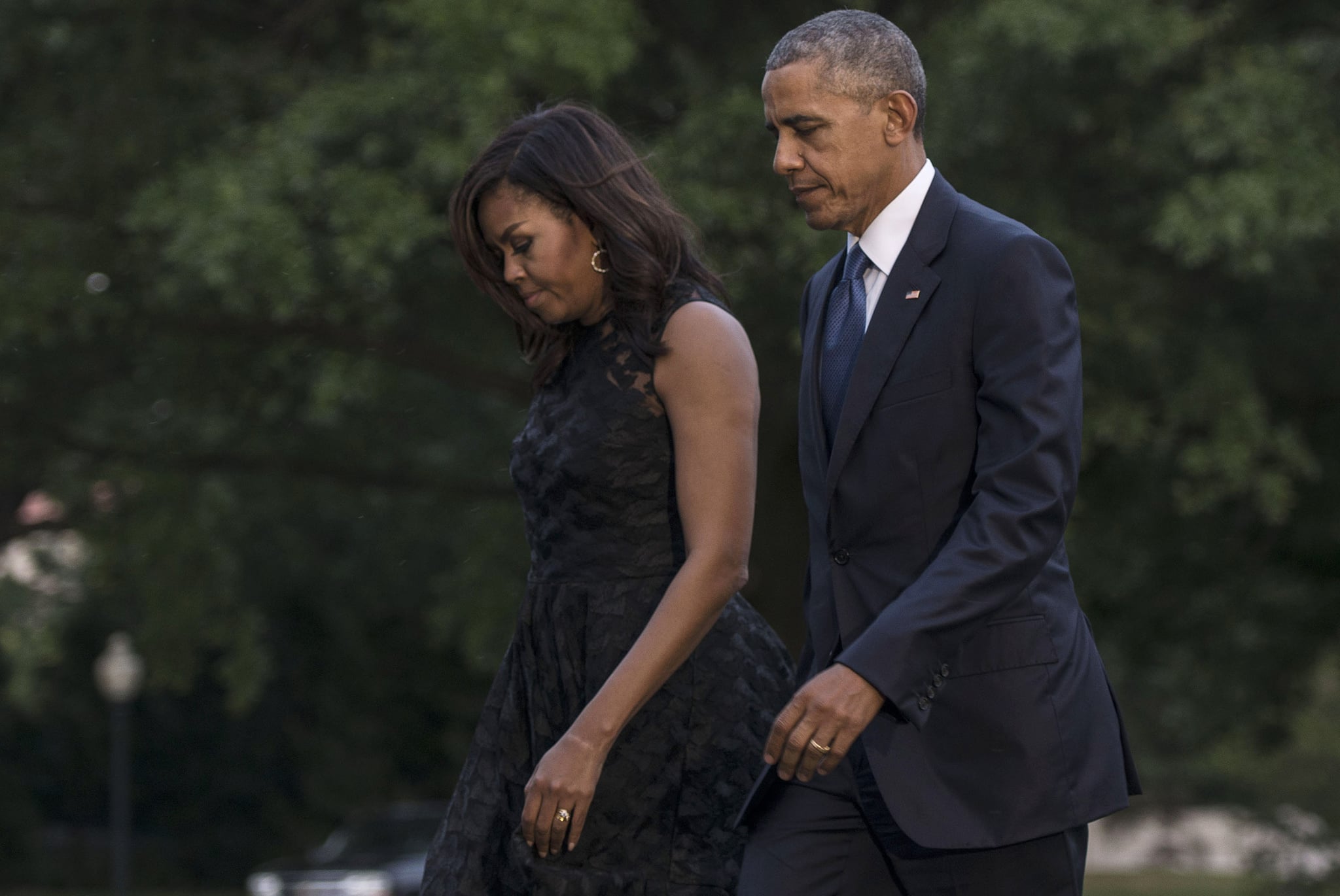 WASHINGTON, DC - JULY 12:  First Lady Michelle Obama and President Barack Obama depart Marine One after visiting Dallas, Texas, where the President delivered remarks at an interfaith service at the Morton H. Meyerson Symphony Centre with the families of the fallen police officers and members of the Dallas community at The White House on July 12, 2016 in Washington, DC.  (Photo by Leigh Vogel/WireImage)