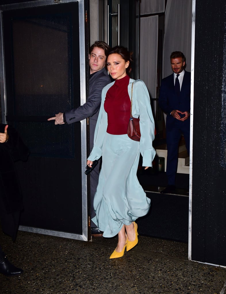 In February 2018, Victoria wore yellow pumps with a sky blue skirt and matching top over a burgundy crewneck sweater.