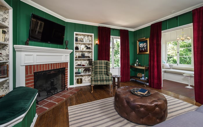 Each room is filled with original details, like this killer wood-burning fireplace.