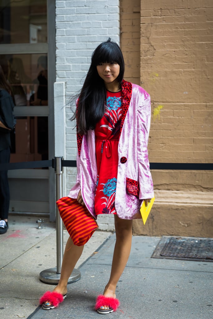 Susie Lau's pink crushed velvet blazer had hints of red on the pockets and lapels, which was the key to making it pair well with her dress.