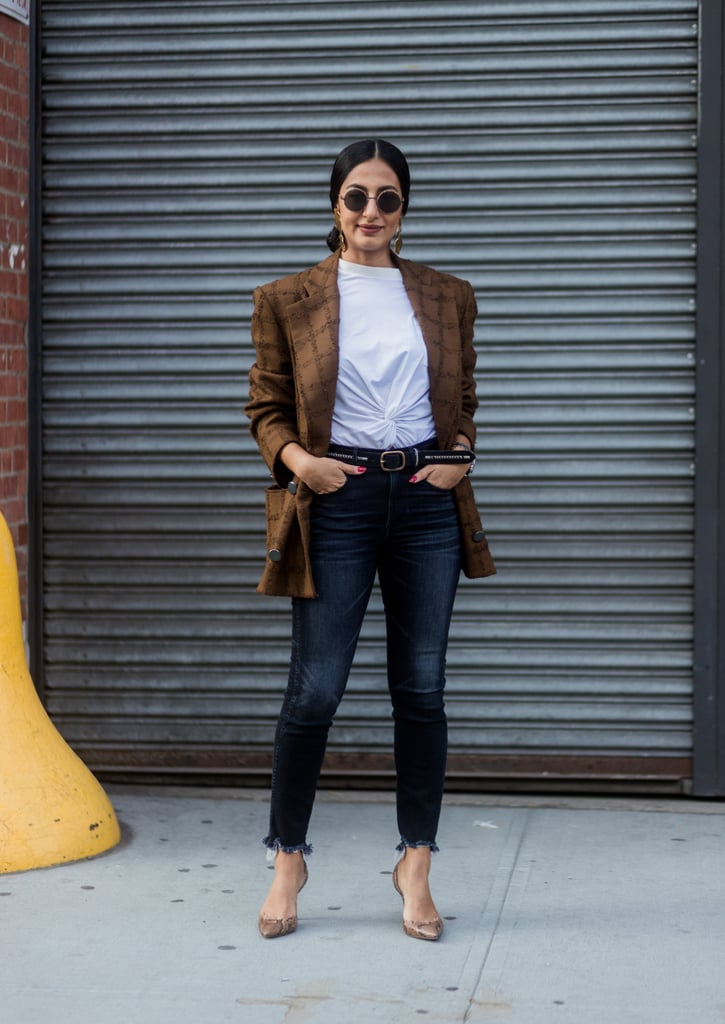 The Fall uniform we spot on fashion girls everywhere involves three pieces: a blazer, a t-shirt, and jeans. Accessorize to your taste either with jewelry or a belt to make the look your own.