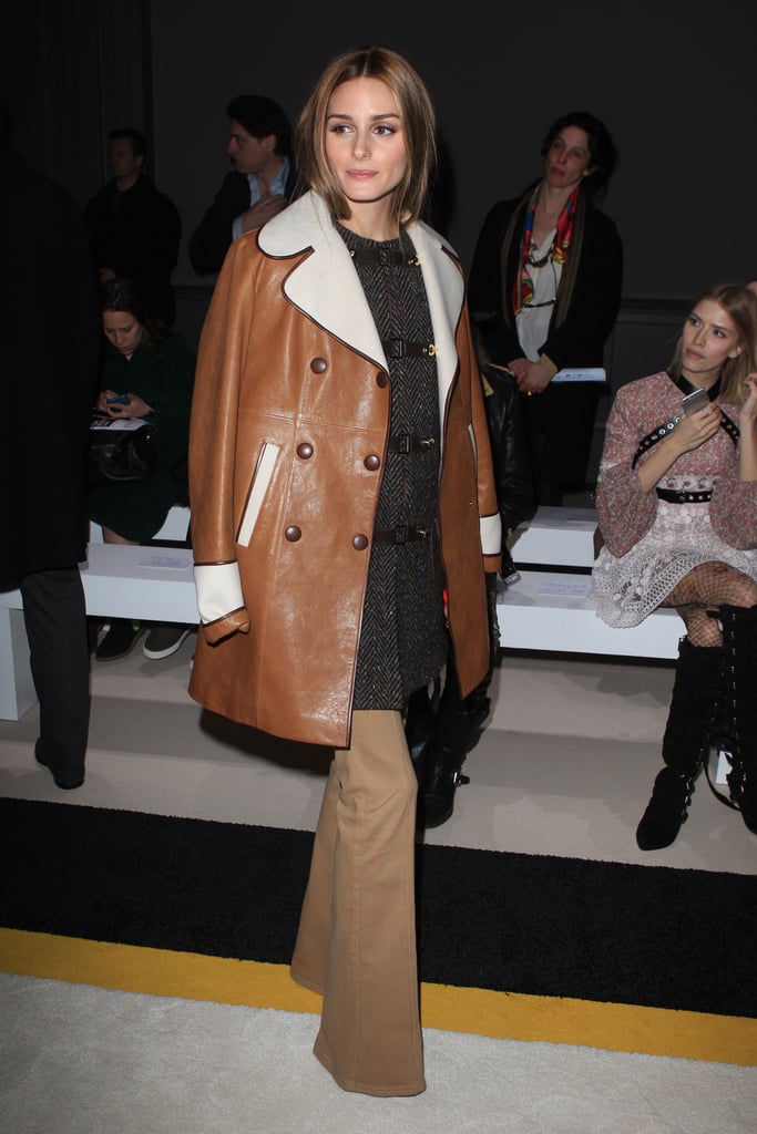 Olivia tried out a new trend at Giambattista Valli — coat layering. The style setter donned a sleek leather jacket with a white lapel but layered it over a tweed jacket for a surprising look that proves when it comes to creative styling, Olivia is a pro.