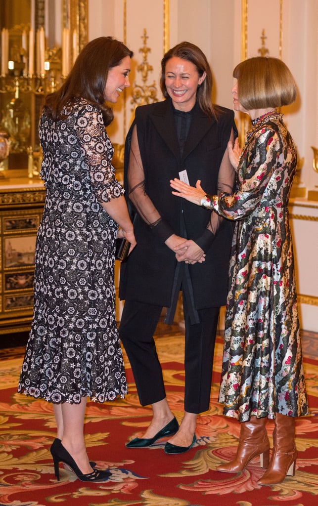 Kate wore a bespoke version of an Erdem dress while chatting with Anna Wintour at the Commonwealth Fashion Exchange initiative at Buckingham Palace in Feb. She paired the dress with Prada suede heels and Anita Dongre pearl earrings.