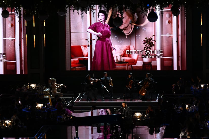 Late US actress Betty White is seen onscreen during an In Memoriam segment performed by US singer-songwriter John Legend onstage during the 74th Emmy Awards at the Microsoft Theater in Los Angeles, California, on September 12, 2022. (Photo by Patrick T. F