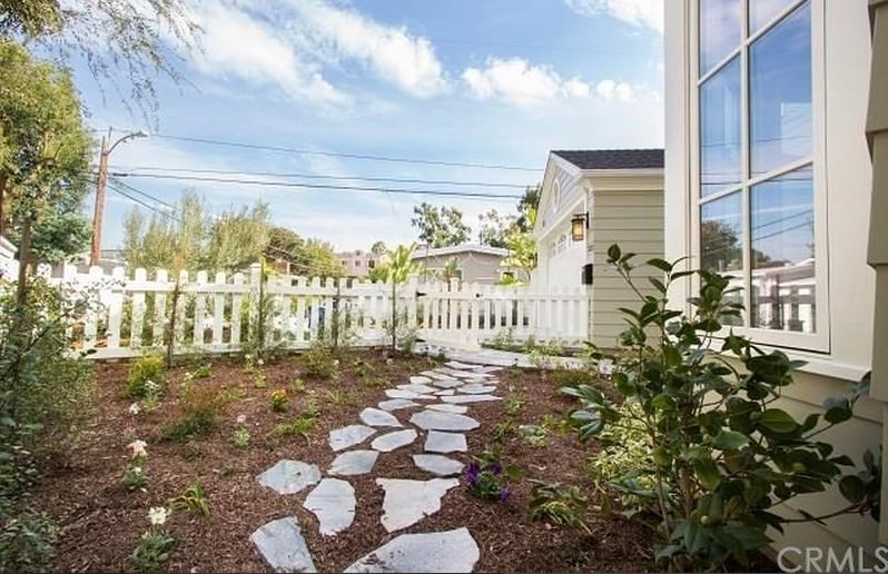 With large windows, perfect landscaping, and a white picket fence, this home is basically the American dream.