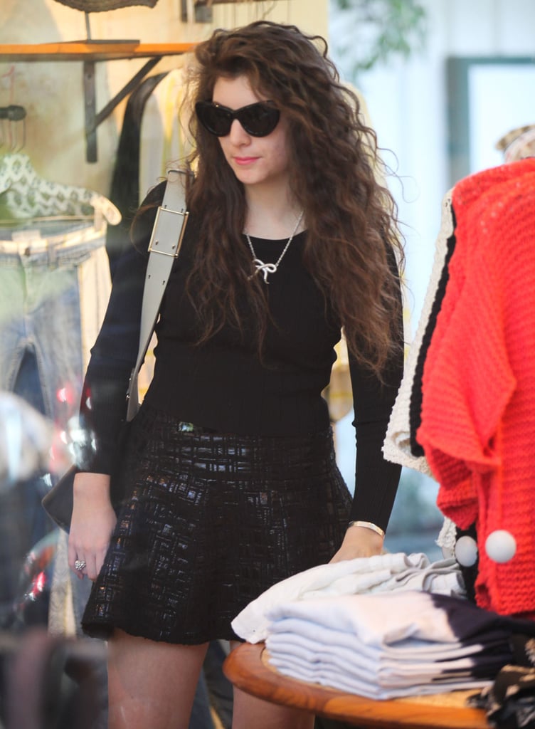Lorde in a Black Skater Skirt and Long-Sleeve Top