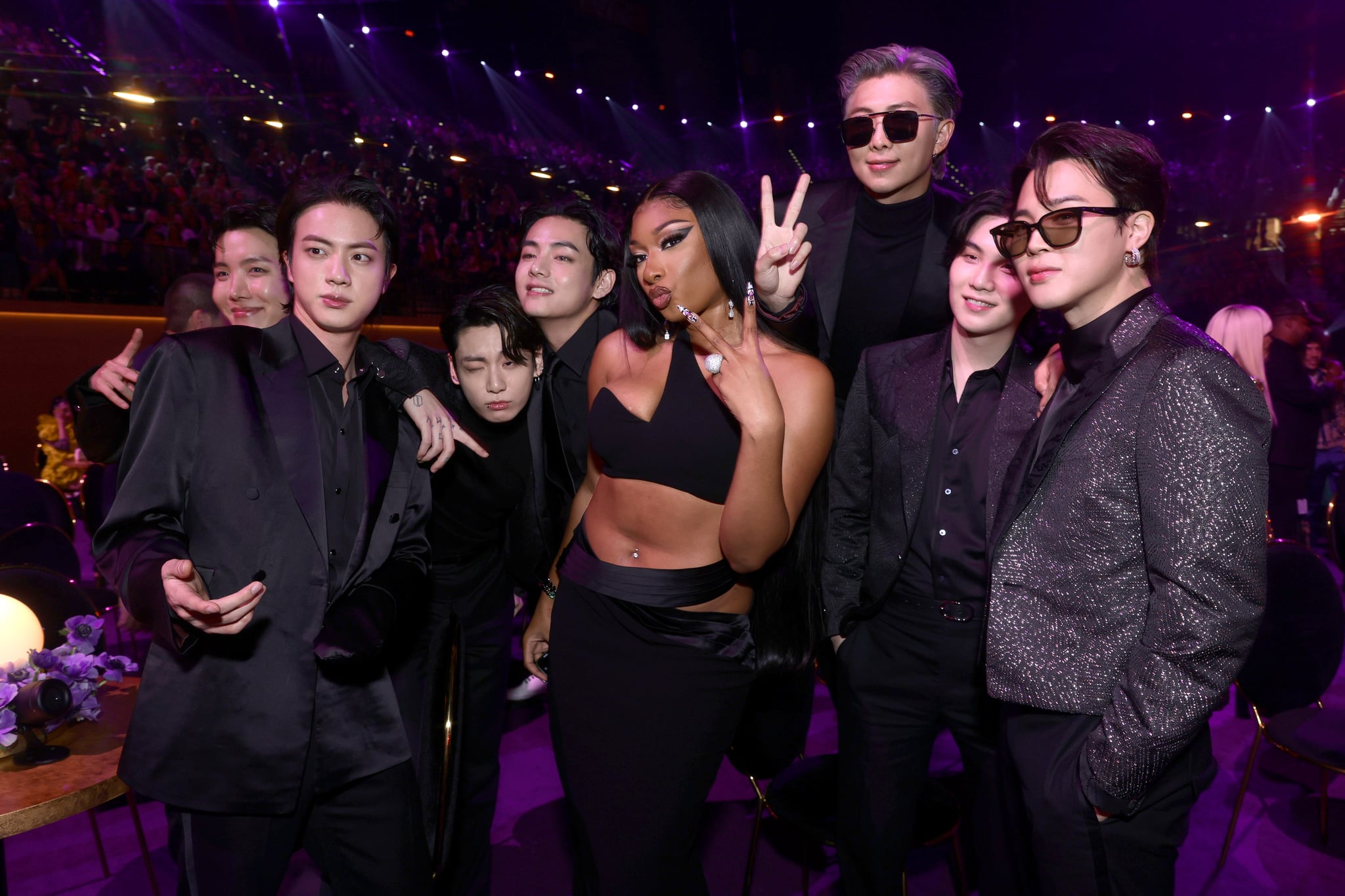 LAS VEGAS, NEVADA - APRIL 03: Megan Thee Stallion (C) and (from L) J-Hope, Jin, Jungkook, V, RM, Suga, and Jimin of BTS attend the 64th Annual GRAMMY Awards at MGM Grand Garden Arena on April 03, 2022 in Las Vegas, Nevada. (Photo by Emma McIntyre/Getty Images for The Recording Academy)