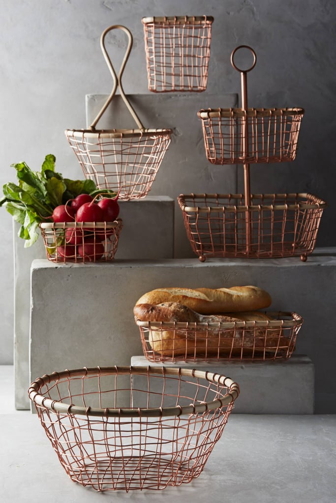 Fruit, mail, towels; whatever you put in these brushed wire storage baskets ($12-68) will look beautiful.