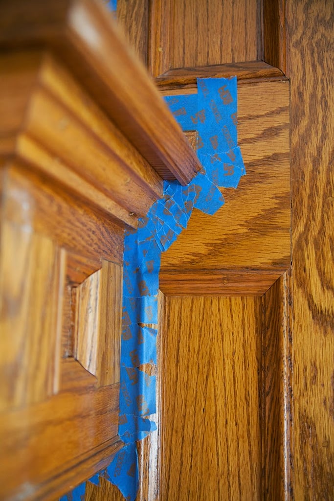 The transformative DIY was fairly simple. Gwen began by carefully taping the fireplace and applying a coat of primer.