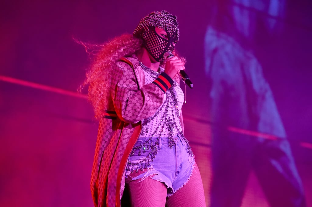 Rocking a Bold Gucci Headpiece, Logo Jacket, and Thigh-High Boots