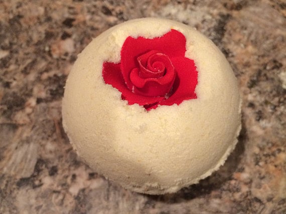 This elegant (and huge — it's about the size of a tennis ball!) Rose Bomb ($4) from HeidiHandmadeDesigns contains epsom salts to relax sore muscles. The molded flower packed inside the lemon-scented bomb floats through the tub long after the fizz has dissolved.