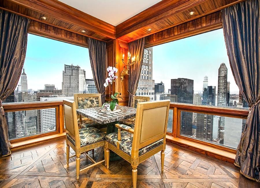 Inlaid wood floors give the apartment an opulent vibe.