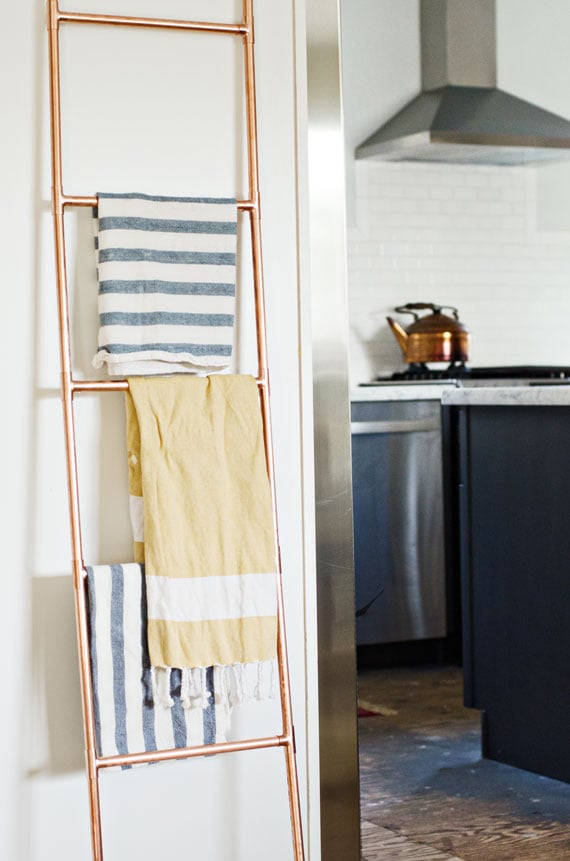 Don't hang a towel rack — lean a ladder.