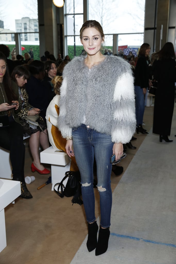Olivia kicked off London Fashion Week at Emilia Wickstead in a furry Charlotte Simone jacket, distressed Black Orchid skinny jeans, and Tabitha Simmons boots.