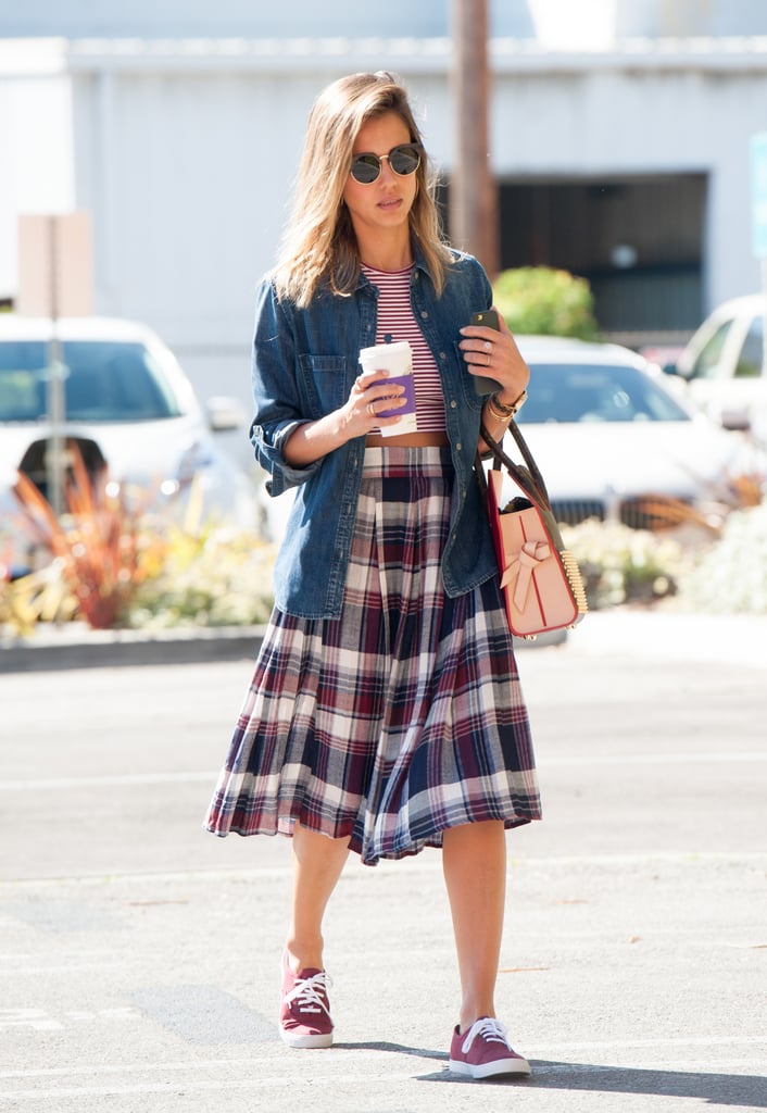 We love how Jessica layered her denim shirt over a crop top, giving her plaid skirt a schoolgirl-type twist.