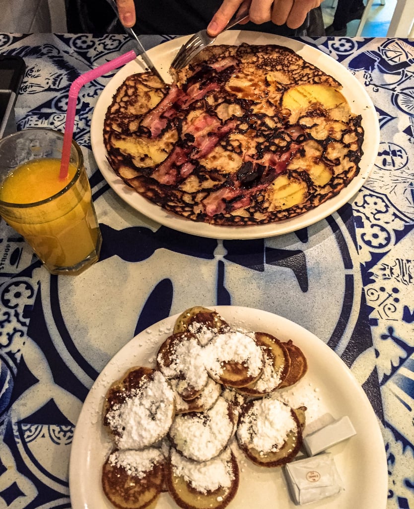 What would a trip to Amsterdam be without pancakes? And if you're as much of a pancake-lover as I am, you're in luck because you can get them everywhere. Yes, really — there are options all throughout the city!  
Pancakes Amsterdam is a particularly tasty choice. Whether you're craving a gigantic Dutch pancake or teeny-tiny poffertjes covered in powdered sugar, this place has you covered.
And if you just can't get enough of these hotcakes, the Pancake Bakery is another delicious go-to. This two-story converted warehouse serves massive sweet and savory pancakes and has beautiful canal views.