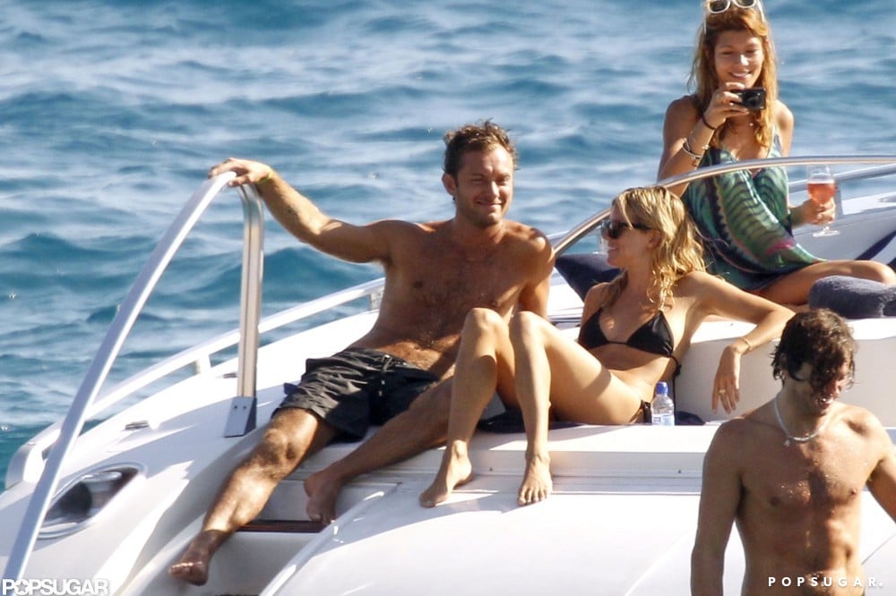 Sienna Miller and Jude Law soaked up the sun on a boat in Ibiza in August 2010.