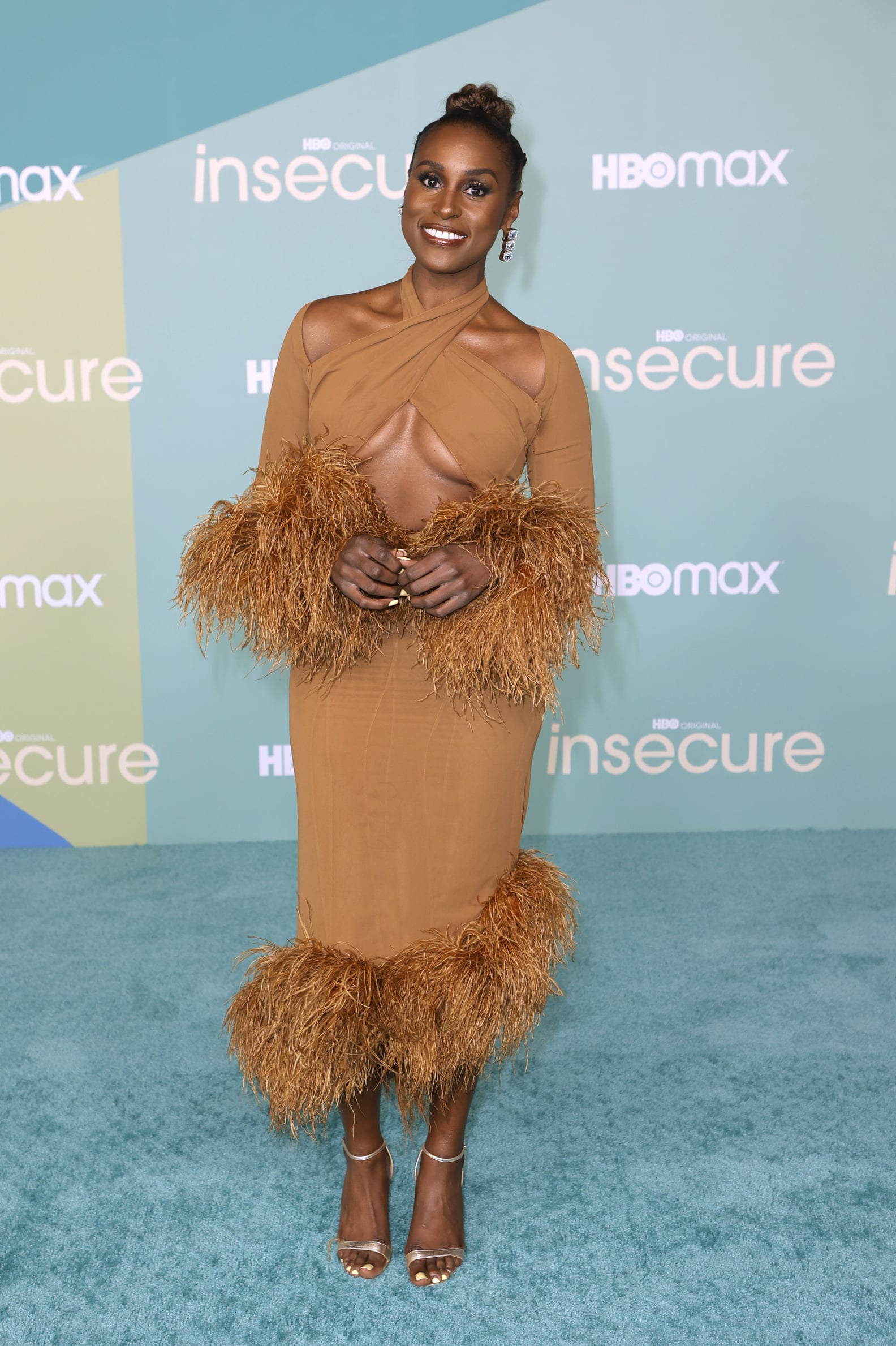 Issa Rae Wears a Sexy Feather-Trimmed Dress by Rokh | PS Fashion