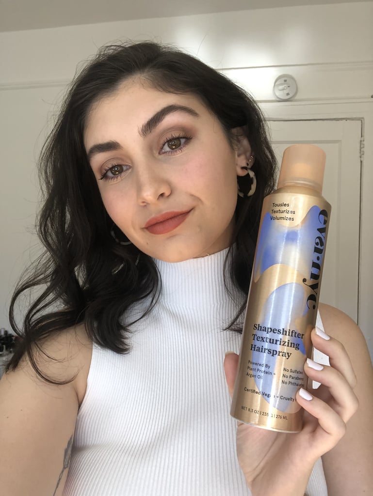 The hairspray-texturizer hybrid is supposed to add volume and texture to hair, while also locking a style in place, sans any stickiness. It's certified vegan and powered by plant proteins and argan oil. The first day I went to test it out, I followed my normal styling routine — with a heat protectant spray and one-inch curling wand — but set my waves with the Shapeshifter Texturizing Hairspray. My first impression: damn, this product smells good.
The fine mist covers a lot of area and feels more like a dry texture spray than a hairspray — there's no sticky residue or tackiness left on your hair. After giving my head a quick upside-down hair flip for good measure, I was still able to run my fingers through the curls without any knots. Overall, my hair had more body and a nice shine. It easily passed the first day test by holding my loose waves in place. That night, I went to sleep with my hair in a high ponytail held back by a silk scrunchy, and prayed the morning results would hold up to my expectations.