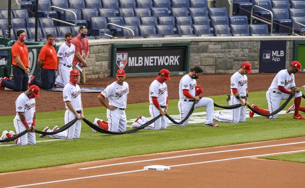 See MLB Players Kneel For Racial Justice on Opening Day