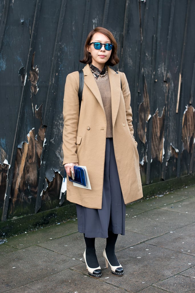 Who knew how well a classic camel coat paired with brilliant, mirrored shades?