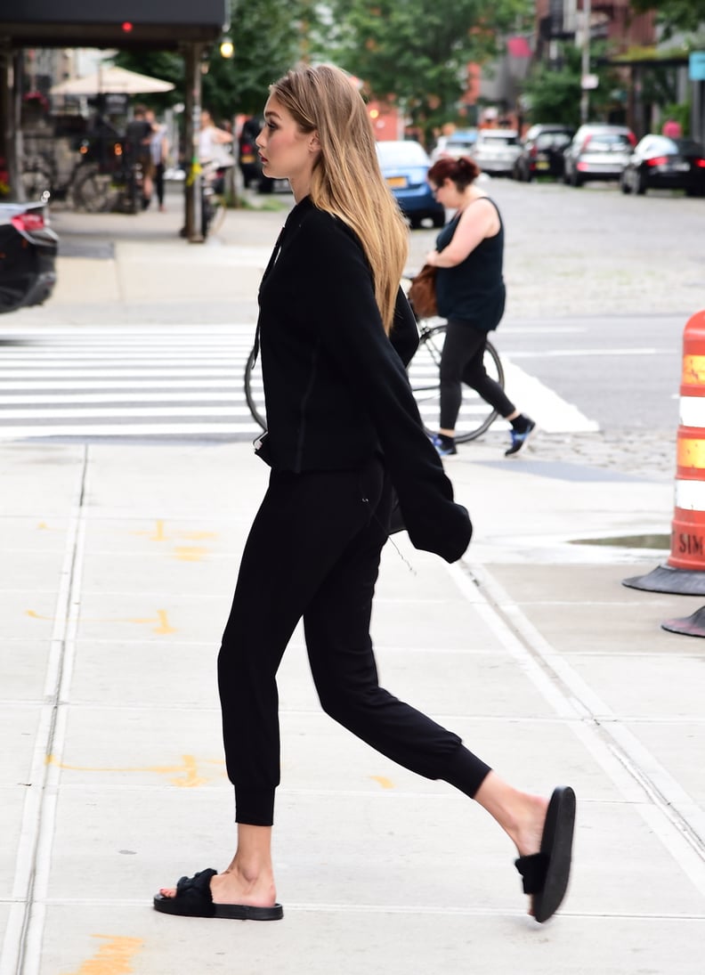Gigi Paired Her Black Slides With an All-Black Outfit