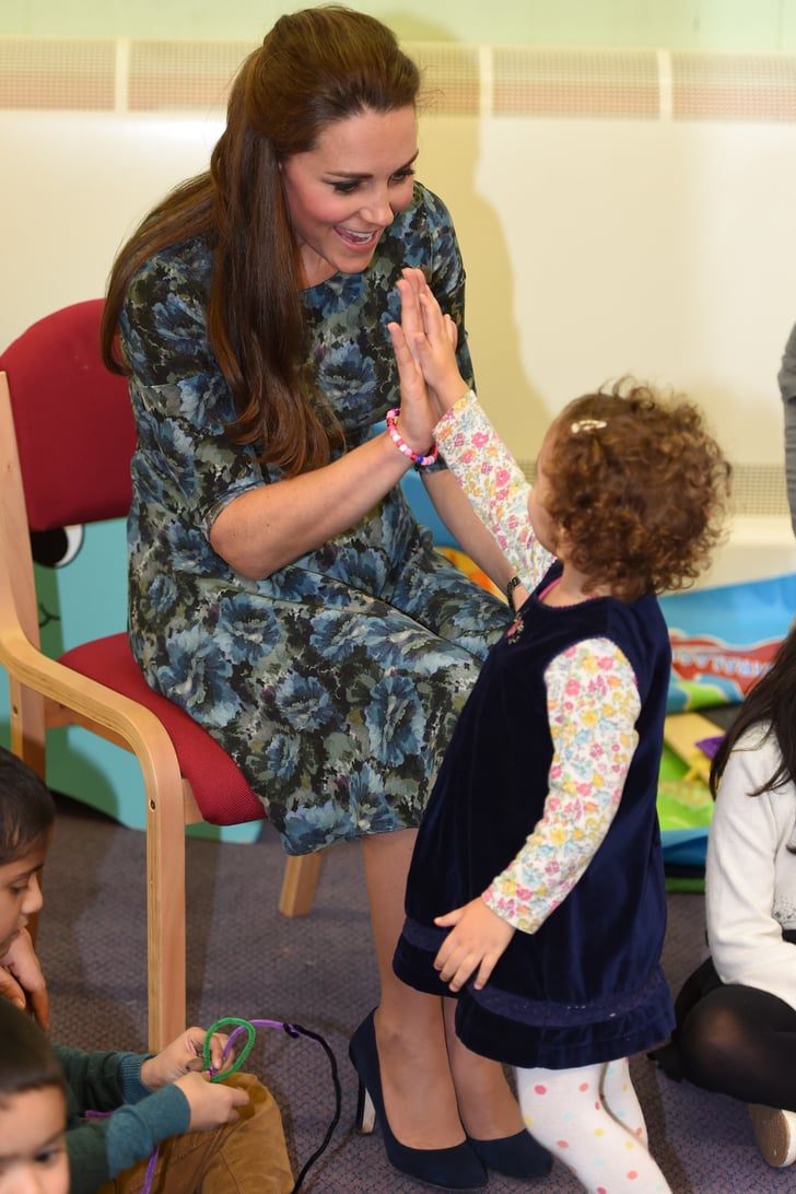 Pregnant Kate high-fived this little cutie during a children's centre ...