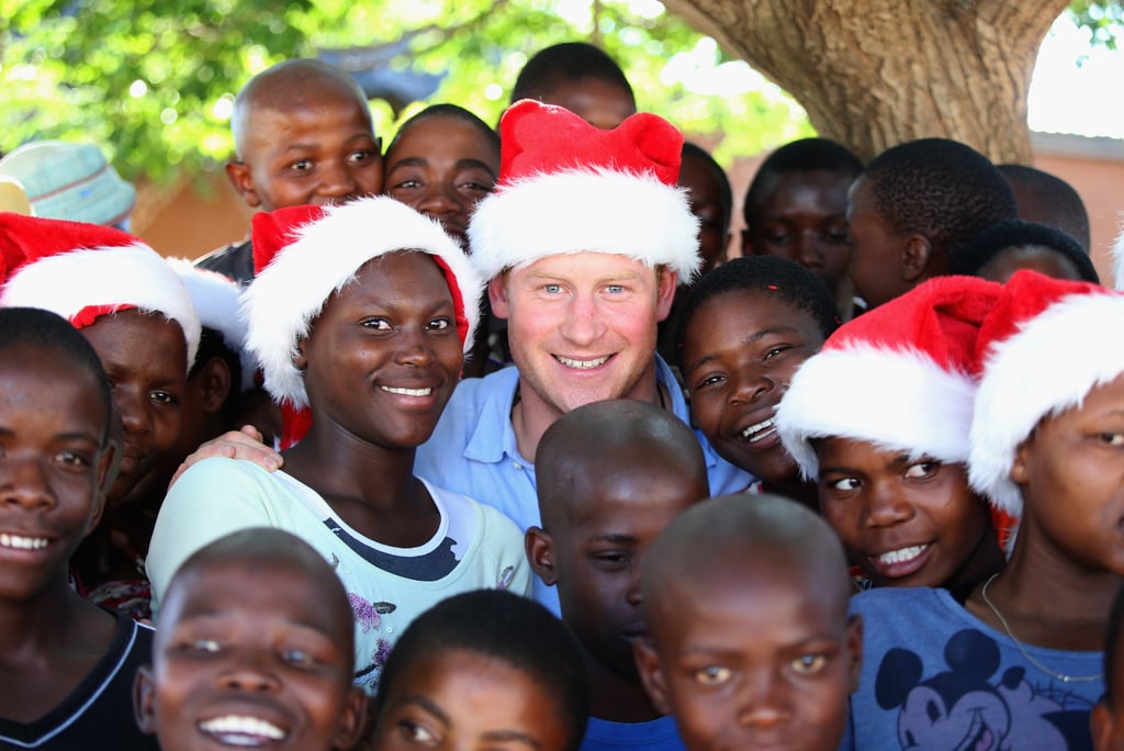 Prince Harry posed with a group of kids in Christmas hats at the Mants'ase Children's Home in 2014. His visit to Lesotho, South Africa, was part of a tour of his charity, Sentebale, which provides health care and education to vulnerable children in the area.