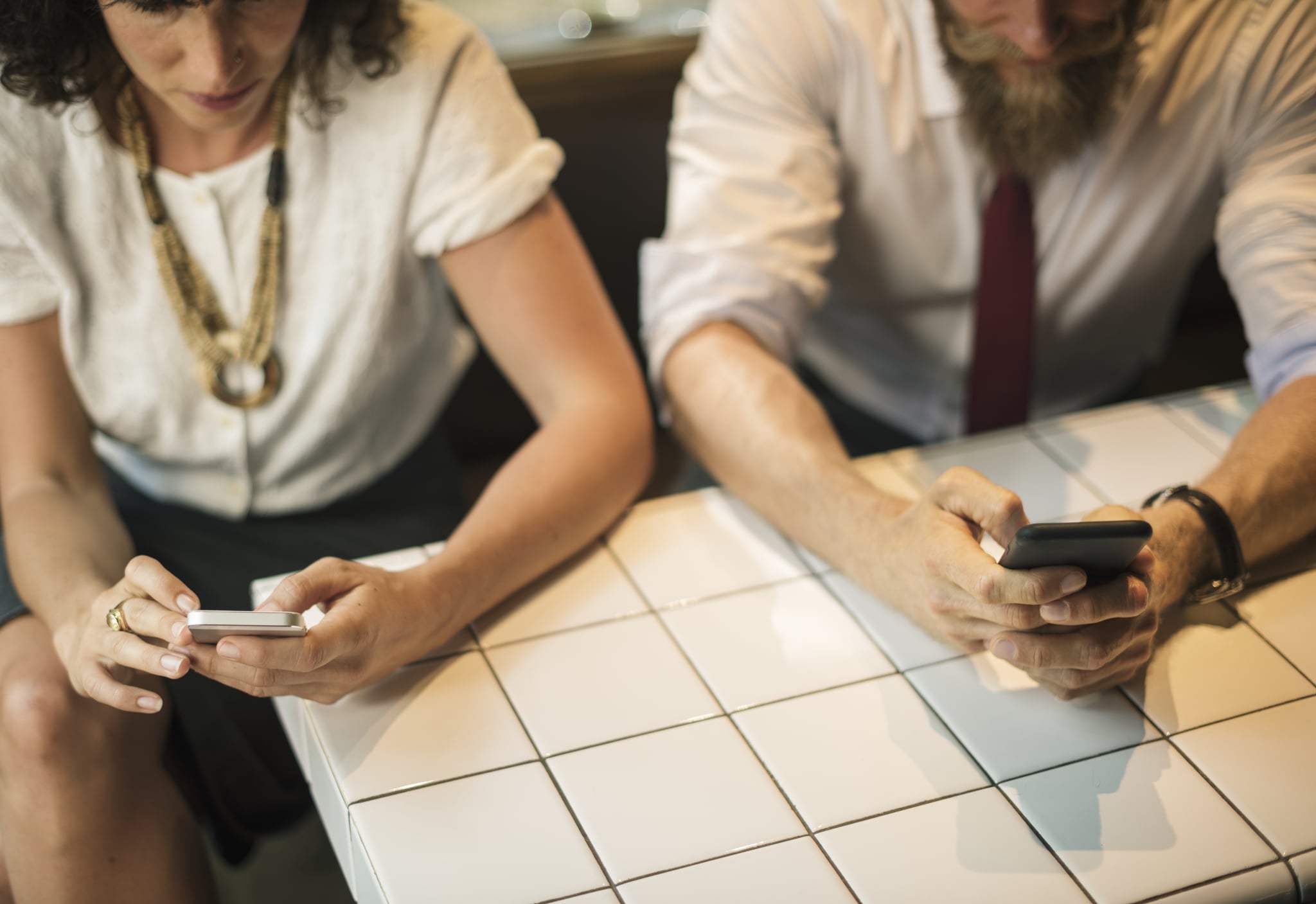 Business People using the phone at coffee shop