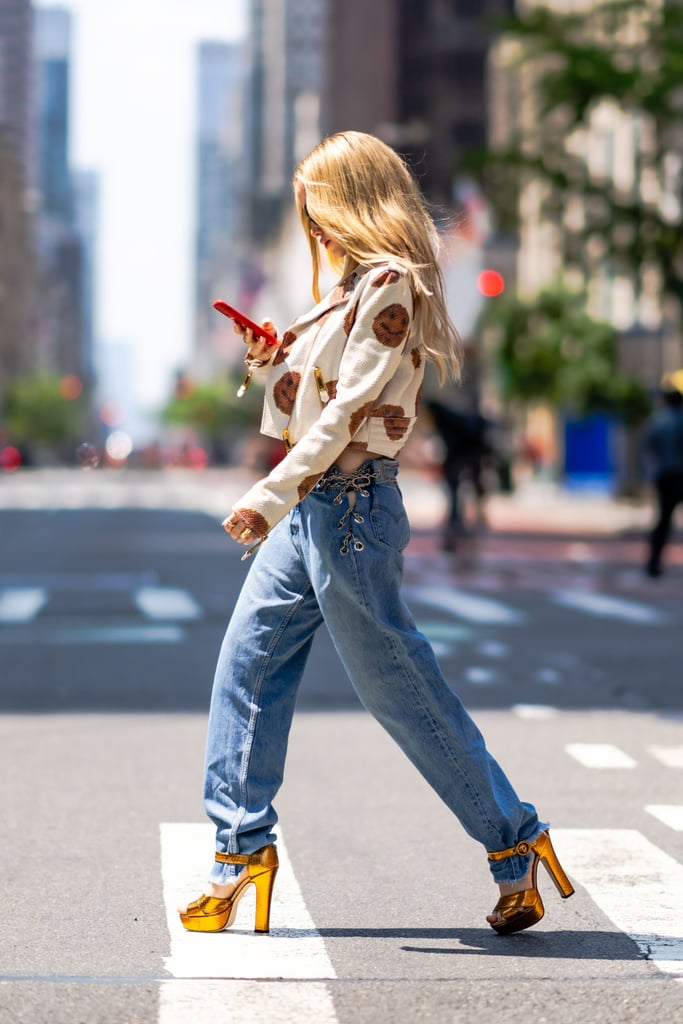 Dove Cameron Wearing Low-Rise Jeans and Moschino Top in NYC