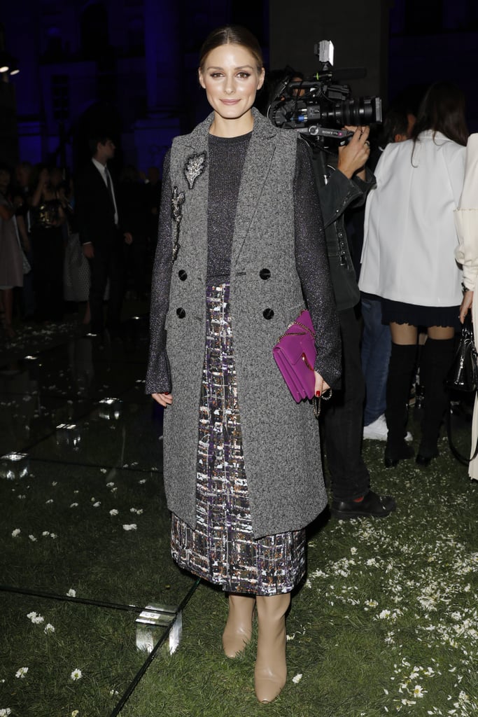 For the Salvatore Ferragamo show in Milan, Olivia perfected sophisticated with a twist, adding a long-line sleeveless vest to a tweed skirt and boots.