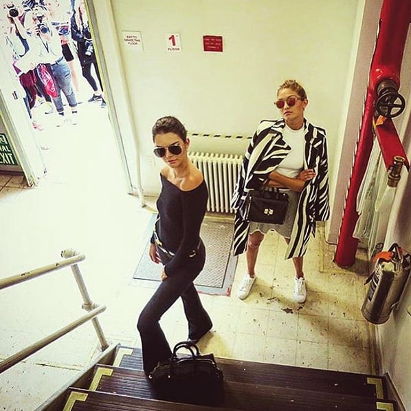 Kendall posed alongside Gigi Hadid while photographers fought to snap their photos from outside.