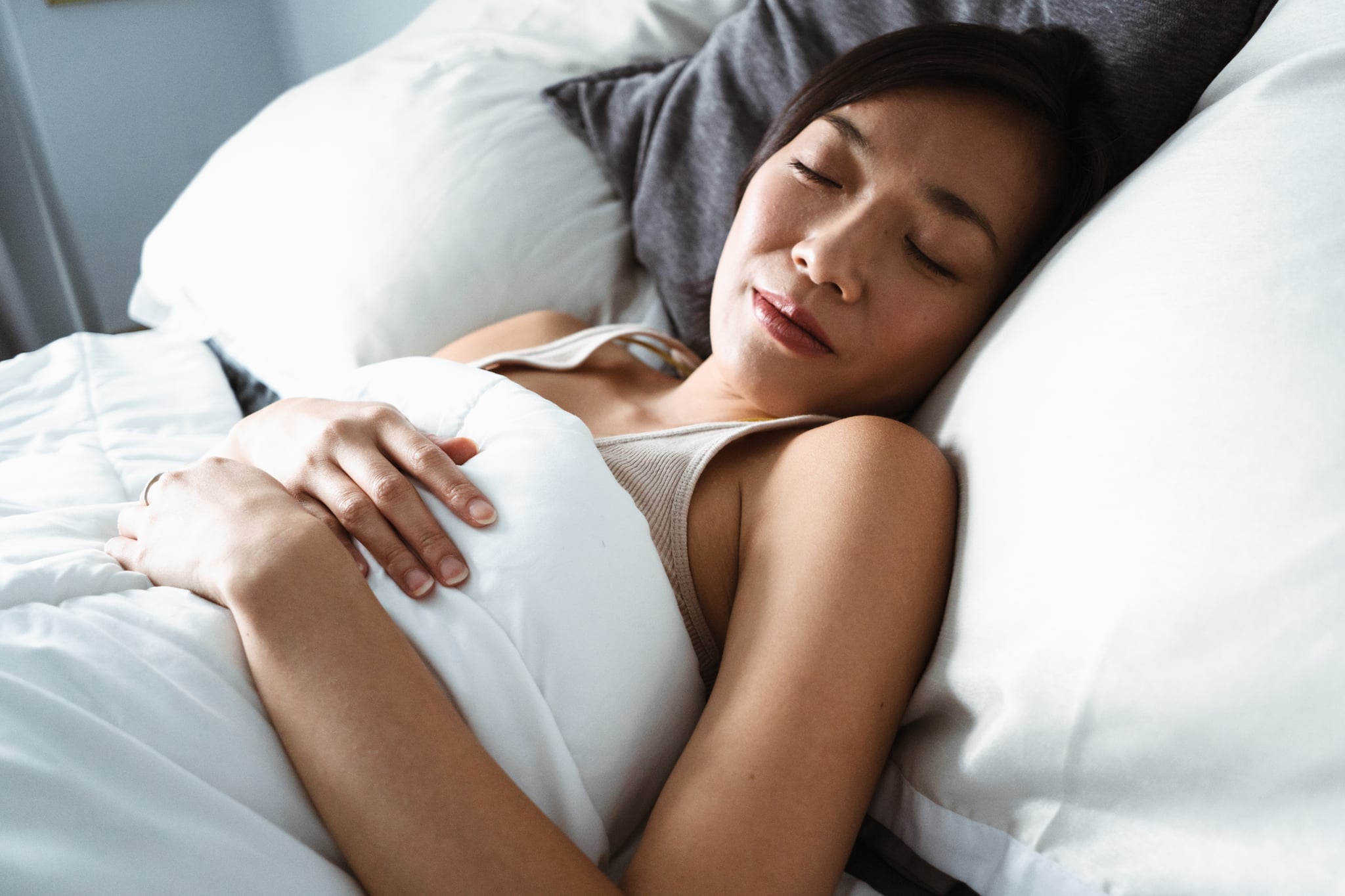 chinese woman sleeping on the bed