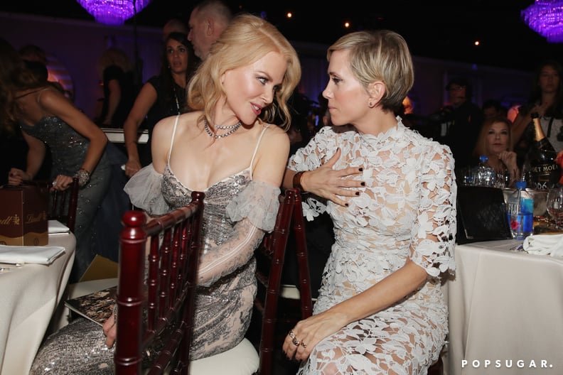 Nicole Kidman and Kristen Wiig had a chat between tables.