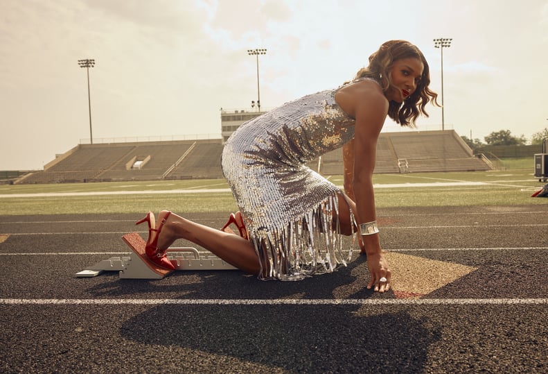 Gabby Thomas track and field star in silver sparkling dress.