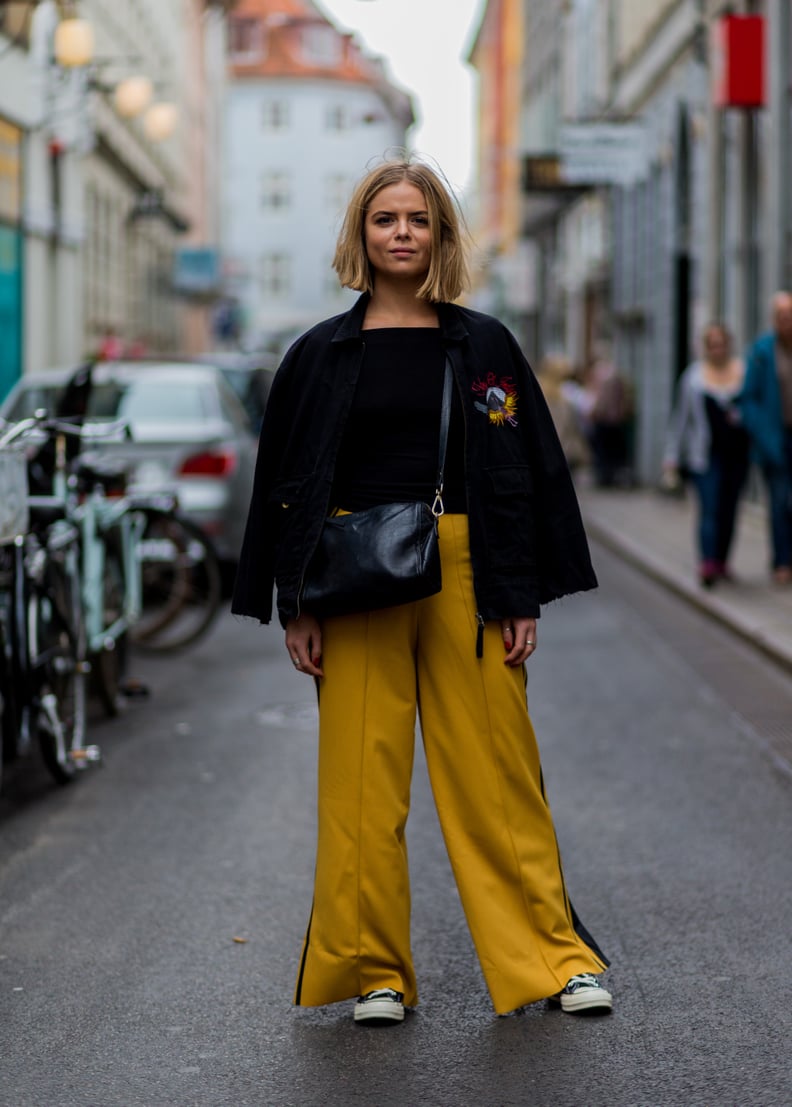 With a Black Top, a Black Jacket, and Mustard Palazzo Trousers