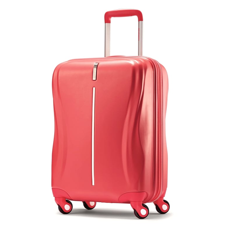 American Tourister 20-Inch Avatar Hardside Spinner Suitcase in Coral