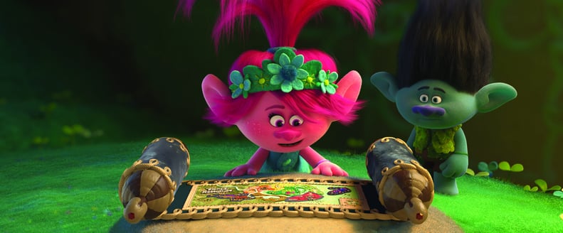 (from left) – Poppy (Anna Kendrick) discovers a map containing the whereabouts of all the Trolls villages in the land while a very skeptic Branch (Justin Timberlake) looks on in 